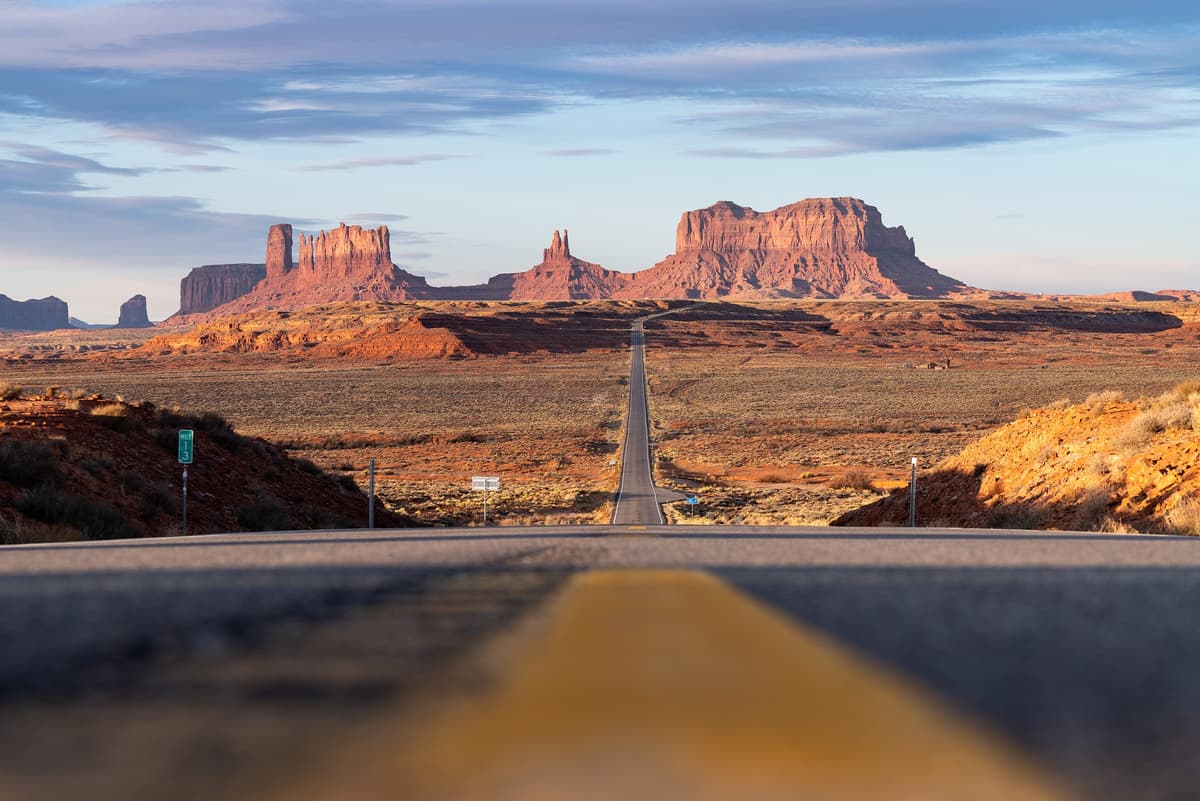 Monument Valley road stretching into the Arizona desert